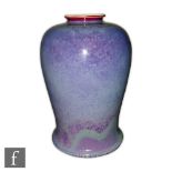 Ruskin Pottery - A high fired vase of swollen tapering form with an all over mottled purple and