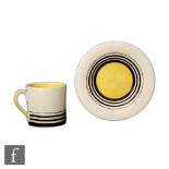 Susie Cooper - A small Tango coffee can and saucer, hand painted with graduated black bands and a