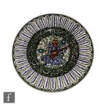 Albert Wainwright - Castleford Peasant Pottery - A circular side plate circa 1919, hand painted with