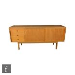 Gordon Russell Furniture - A model R421 sideboard, fitted with an arrangement of three drawers