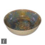Ruskin Pottery - A 1920s eggshell footed bowl decorated in a mottled yellow and blue lustre glaze,