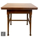 William Birch - An oak fold-over card table raised to ring turned legs united by an H-form