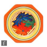 Clarice Cliff - Umbrellas An octagonal side plate circa 1930 hand painted with a central