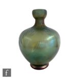 Loetz - A glass vase of footed ovoid form with swollen collar neck,