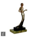 In the manner of Lorenzl - A 1930s Art Deco bronze figure of a lady in a long evening dress with