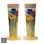 Clarice Cliff - Delecia Pansies - A pair of shape 613 vases of footed ribbed cylindrical form