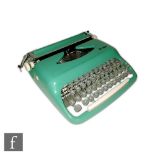 Unknown - A 1950s portable typewriter model number 1531 in mint green, with cream leather carry