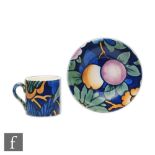 Crown Devon ? A coffee can and saucer decorated with flowers and foliage with a tonal turquoise