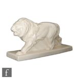 Unknown - A 1930s Art Deco model of a stylised prowling lion, the whole with a craquelure glaze,
