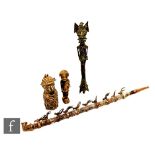 Four African tribal metal work items, a carved wooden pipe decorated with ten stylised metal