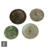 A collection of Chinese Ming Dynasty (1368-1644) style bronze mirrors, each of circular form, cast