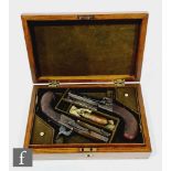 A cased pair of travelling pistols by Anderson London, 7.5cm octagonal barrels, leaf engraved