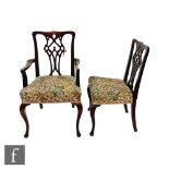 A set of eight Chippendale style mahogany dining chairs, pierced vases splats, tapestry seats, on