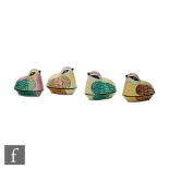 A set of four 20th Century Chinese painted enamelled quail egg containers in predominantly yellow