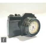A mid 20th Century Mercedes 'Flying Saucer' clock, modelled as a camera in black finish, 12cm x