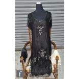 A 1920s / 1930s Art Deco short sleeved tabard dress, the black mesh body with embroidered Glasgow