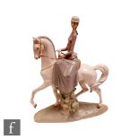 A large Lladro figure modelled as a lady sat side saddle on a horse, printed mark, height 45cm,