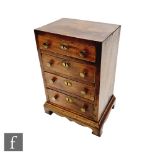 A small 19th Century mahogany apprentice chest of four long drawers,
