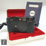 A Leica M6 black, circa 1988, serial number 1743962, with passport 10404 and dealers stamp, purchase