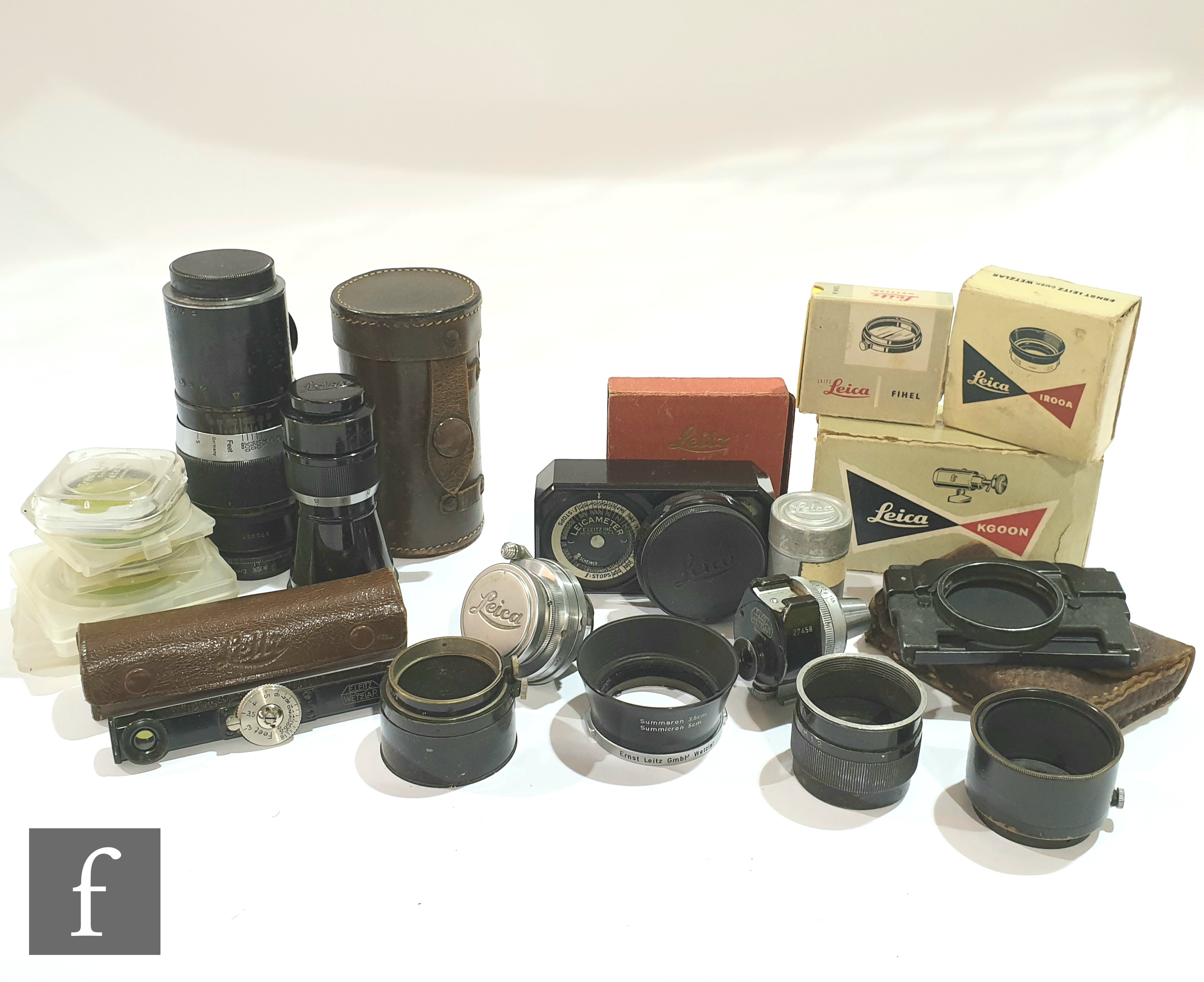 A collection of Leica Ernst Leitz Wetzlar lenses and accessories, to include a Hektor f= 13.5 cm 1: