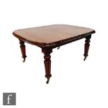 A Victorian mahogany extending dining table, the double moulded edge top over a plain frieze on