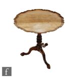 A George III style and later carved mahogany tripod occasional table with bird cage action, on