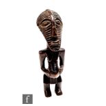 An African Songye Kifwebe fertility figure, Democratic Republic of Congo, standing female figure