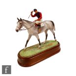 A Royal Worcester equestrian figure The Winner, modelled by Doris Lindner, the jockey in Queen's