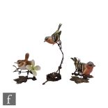 Three Albany Fine China models of garden birds comprising two chaffinches and a wren, all perched on