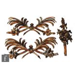 A pair of 19th Century carved stained soft wood door or over mantle embellishments in the form of