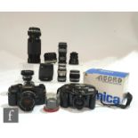 A collection of Canon, Tamron and Konica cameras and lenses, to include a Canon A-1 SLR camera, with