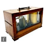 An early 20th Century German oak cased barograph, with hinged glazed cover with brass carry handle