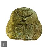 A medieval bronze monumental plaque partifact, circa 1300-1500, in the form of a male head with