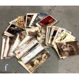 A large collection of loose Edwardian postcards to include advertising, animals, dogs, horses