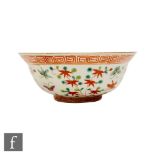 A Chinese famille verte bowl, (Tongzhi 1862-1874) seal mark to base, decorated with red flowering