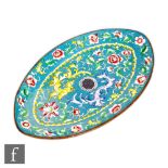 A Chinese Qianlong (1735-96) style enamelled tray of tapered oval form, the blue ground with central