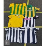 Two West Bromwich Albion blue and white Umbro shirts, no logos, a yellow shirt, no logo, an Umbro