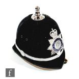 A 20th Century six panel blue cloth policeman's helmet for the Derbyshire Constabulary, leather chin