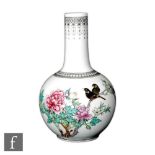 A 20th Century Chinese bottle vase, the white glazed body decorated with flowering lotus branches