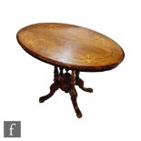 A small Victorian inlaid marquetry oval centre table on four turned pillar supports on splayed legs,