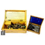 A Walker 'Excelsior' IV patent marine log in oak case and an oak cased set of drawing