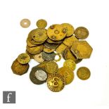 A collection of pit and other brass tokens. (qty)