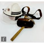 A West Midlands officers fireman's helmet with visor, a fireman's axe with leather holder and a