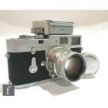 A Leica M2 rangefinder camera, circa 1960, serial number 982140, chrome body, with fitted M2