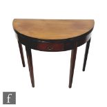 A late Georgian mahogany demi-lune tea table fitted with single drawer,