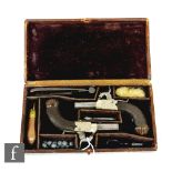 A cased pair of 19th Century percussion pocket pistols by Dooley Liverpool, engraved silvered