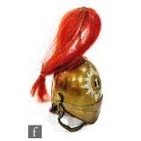 A 20th Century miniature officer's brass dragoons helmet No 1 with chin strap and red plume,