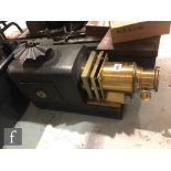 A Victorian brass magic lantern, converted to electricity, length 61cm, and two wooden cases of