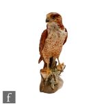 A large later 20th Century bisque Kaiser model of a peregrine falcon, blue printed mark, numbered