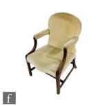 A late 19th and early 20th Century mahogany framed Gainsborough style elbow chair, swept arms on
